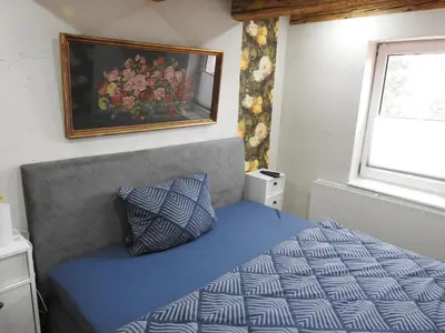 Ein Bett oder Betten in einem Zimmer der Unterkunft Alter Wirt