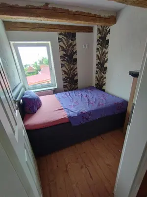 Ein Bett oder Betten in einem Zimmer der Unterkunft Alter Wirt