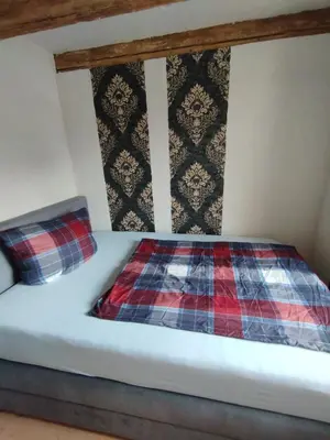 Ein Bett oder Betten in einem Zimmer der Unterkunft Alter Wirt