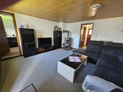 Ein Sitzbereich in der Unterkunft Ferienwohnung zu den Blauen Schafen