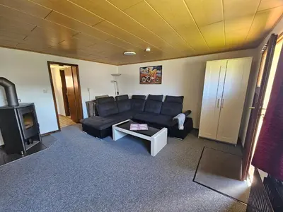 Ein Sitzbereich in der Unterkunft Ferienwohnung zu den Blauen Schafen
