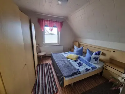 Ein Bett oder Betten in einem Zimmer der Unterkunft Ferienhaus Pusteblume