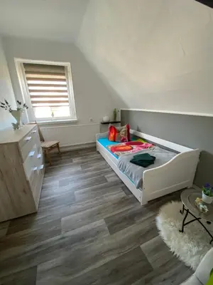 Ein Bett oder Betten in einem Zimmer der Unterkunft Ferienhaus Pusteblume