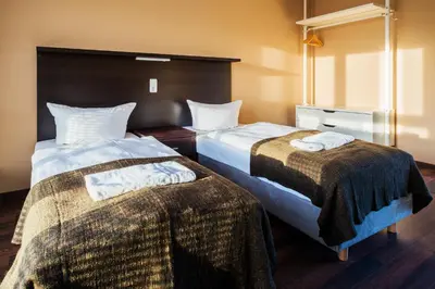 Ein Bett oder Betten in einem Zimmer der Unterkunft Apple City Hotel