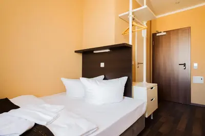 Ein Bett oder Betten in einem Zimmer der Unterkunft Apple City Hotel