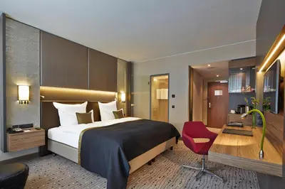 Ein Bett oder Betten in einem Zimmer der Unterkunft Steigenberger Hotel Am Kanzleramt