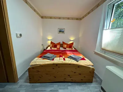 Ein Bett oder Betten in einem Zimmer der Unterkunft Tornower Waldhäusl, perfekt gelegen 60 km vor Berlin, auf der Schwelle zum Spreewald und nahe Tropical Islands