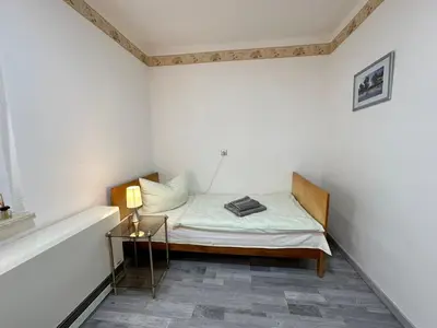 Ein Bett oder Betten in einem Zimmer der Unterkunft Tornower Waldhäusl, perfekt gelegen 60 km vor Berlin, auf der Schwelle zum Spreewald und nahe Tropical Islands