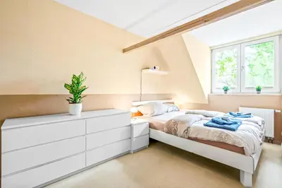 Ein Bett oder Betten in einem Zimmer der Unterkunft Familiengeeignete Ferienwohnung