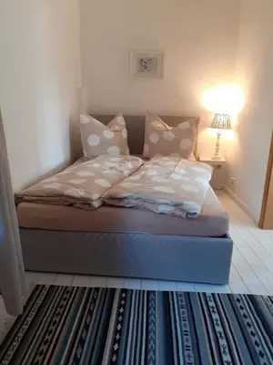 Ein Bett oder Betten in einem Zimmer der Unterkunft Martinsgarten