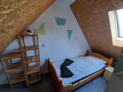 Ein Bett oder Betten in einem Zimmer der Unterkunft De´ Borns Ferienwohnung