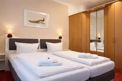 Ein Bett oder Betten in einem Zimmer der Unterkunft FRAME by Comfort Housing - spacious apartment