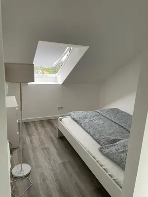Ein Bett oder Betten in einem Zimmer der Unterkunft Wohnung im Gästehaus