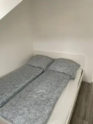 Ein Bett oder Betten in einem Zimmer der Unterkunft Wohnung im Gästehaus