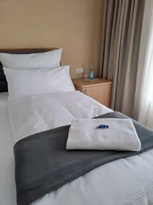 Ein Bett oder Betten in einem Zimmer der Unterkunft Hotel Rhin Inn