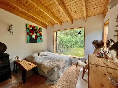 Ein Bett oder Betten in einem Zimmer der Unterkunft Häuschen in den Erlen