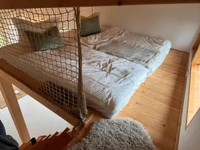 Ein Bett oder Betten in einem Zimmer der Unterkunft Häuschen in den Erlen