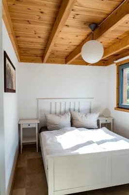 Ein Bett oder Betten in einem Zimmer der Unterkunft Ferienhaus Gartenglück