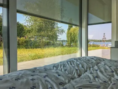 Ein Bett oder Betten in einem Zimmer der Unterkunft Haus am See Storkow