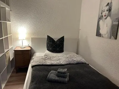 Ein Bett oder Betten in einem Zimmer der Unterkunft Finki's Ferienwohnungen