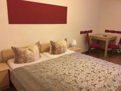 Ein Bett oder Betten in einem Zimmer der Unterkunft Pension am Radweg & Ristorante Juani