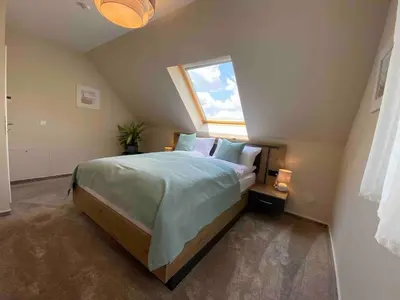 Ein Bett oder Betten in einem Zimmer der Unterkunft Pool Sauna Entspannung