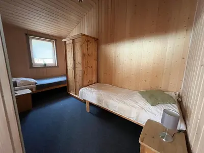 Ein Bett oder Betten in einem Zimmer der Unterkunft Feriendorf Klosterheide