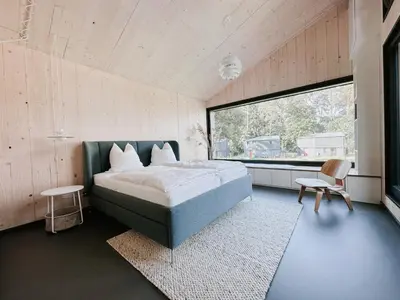 Ein Bett oder Betten in einem Zimmer der Unterkunft Haus 1 - ELF AM SEE