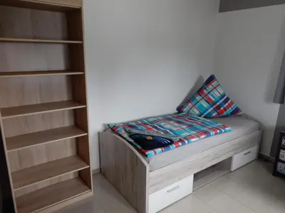 Ein Bett oder Betten in einem Zimmer der Unterkunft Apartment Haus 25