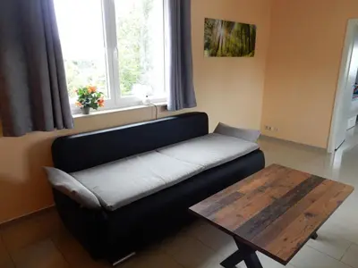 Ein Sitzbereich in der Unterkunft Apartment Haus 25