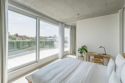 Ein Bett oder Betten in einem Zimmer der Unterkunft Carlotta Apartments