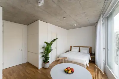 Ein Bett oder Betten in einem Zimmer der Unterkunft Carlotta Apartments