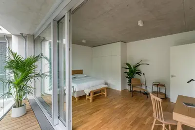 Ein Bett oder Betten in einem Zimmer der Unterkunft Carlotta Apartments