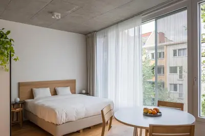 Ein Bett oder Betten in einem Zimmer der Unterkunft Carlotta Apartments