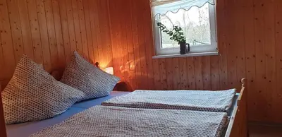 Ein Bett oder Betten in einem Zimmer der Unterkunft ferienhaus-am-scharmützelsee