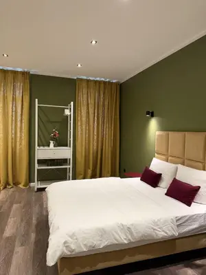 Ein Bett oder Betten in einem Zimmer der Unterkunft Prestige suites