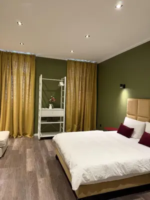 Ein Bett oder Betten in einem Zimmer der Unterkunft Prestige suites