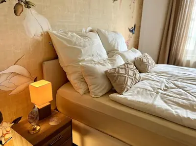 Ein Bett oder Betten in einem Zimmer der Unterkunft BALI HOME Stylische Wohnung mit Terrasse