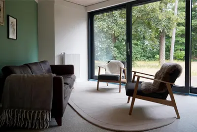 Ein Sitzbereich in der Unterkunft Elf am See - Haus 7