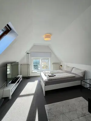 Ein Bett oder Betten in einem Zimmer der Unterkunft Appartment im DG Berlin / 5 min zur Messe