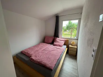 Ein Bett oder Betten in einem Zimmer der Unterkunft Eichkobel