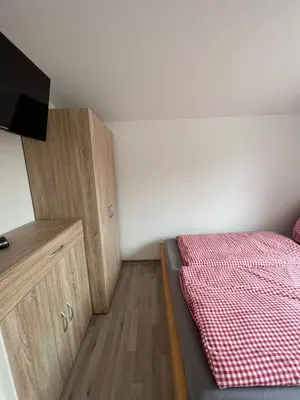 Ein Bett oder Betten in einem Zimmer der Unterkunft Eichkobel