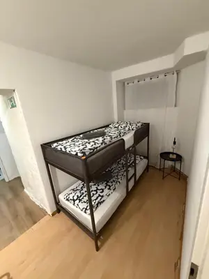 Ein Bett oder Betten in einem Zimmer der Unterkunft Ferienwohnung Kreuzberg