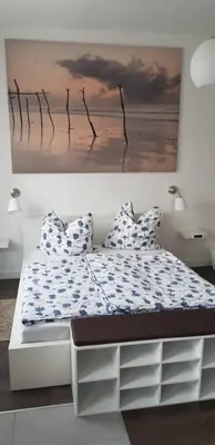 Ein Bett oder Betten in einem Zimmer der Unterkunft Ferienwohnung Zur Rose