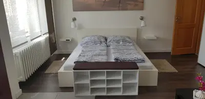 Ein Bett oder Betten in einem Zimmer der Unterkunft Ferienwohnung Zur Rose