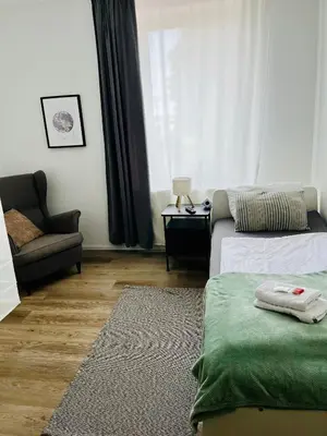 Ein Bett oder Betten in einem Zimmer der Unterkunft OMNI Rooms - Oranienburg