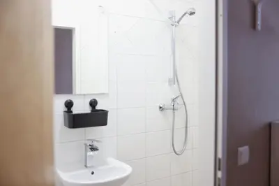 Ein Badezimmer in der Unterkunft OMNI Rooms - Oranienburg