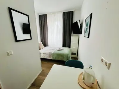 Ein Bett oder Betten in einem Zimmer der Unterkunft OMNI Rooms - Oranienburg
