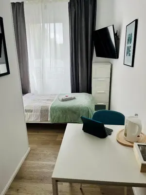 Ein Bett oder Betten in einem Zimmer der Unterkunft OMNI Rooms - Oranienburg