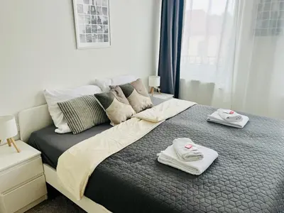 Ein Bett oder Betten in einem Zimmer der Unterkunft OMNI Rooms - Oranienburg